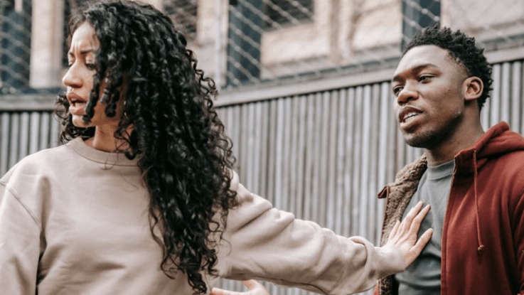 Woman speaking calmly during a difficult conversation, showing the power of words to bring peace.